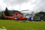 BELL 412 OE-XYY pos sur le chantier, sous la pluie